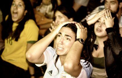 Football fan as Argentina's fourth penalty is stopped by the German goalie